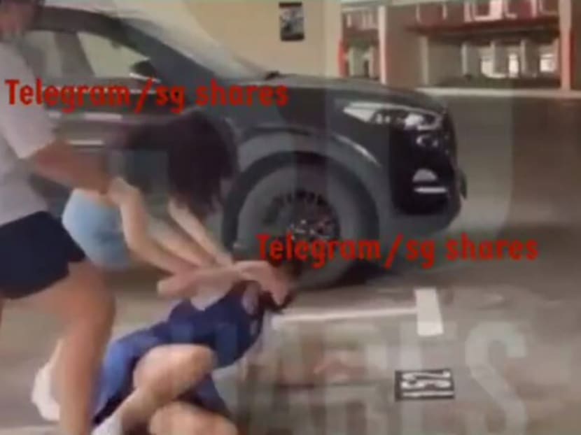 A screengrab of the video clip showing two girls hitting and kicking a girl in a blue school uniform. A screengrab of the video clip showing two girls hitting and kicking a girl in a blue school uniform.