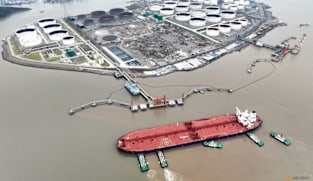 Oil slips on oversupply concerns, stronger dollar 