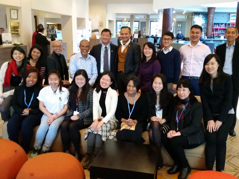 Singaporean activists at the Paris climate talks with Minister for the Environment and Water Resources Masagos Zulkifli today, Dec 9, 2015. Photo: Albert Wai / TODAY