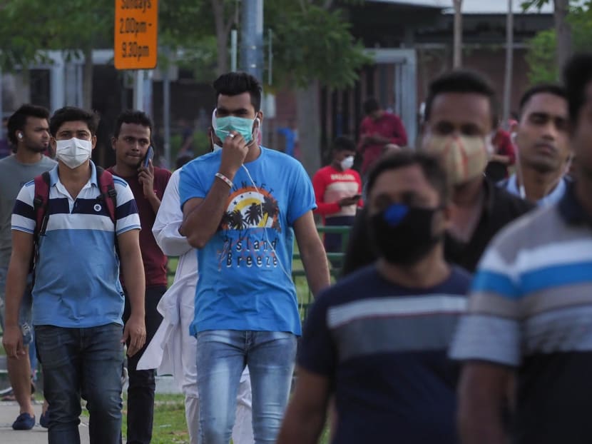 Foreign workers in Little India seen wearing masks.