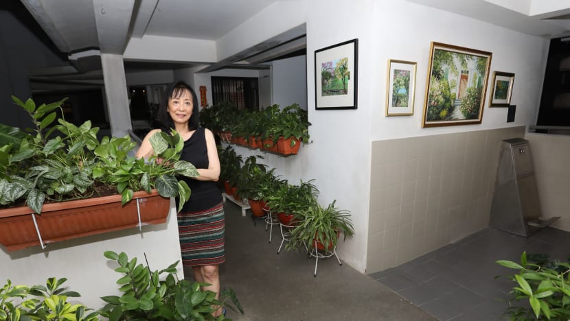 Self-taught artist transforms HDB common corridor into mini art gallery surrounded by greenery