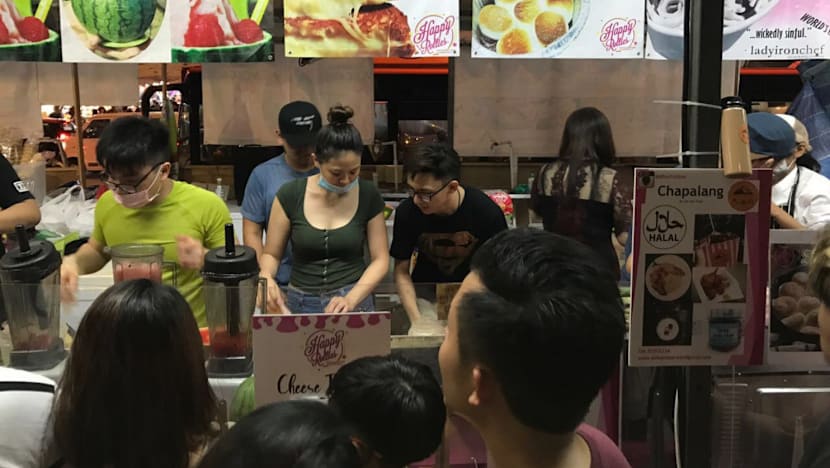 More young people setting up pasar malam stalls