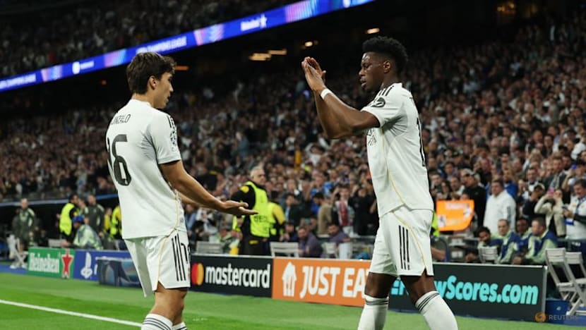 Vinicius scores as Real Madrid sink Benfica to reach Champions League last 16