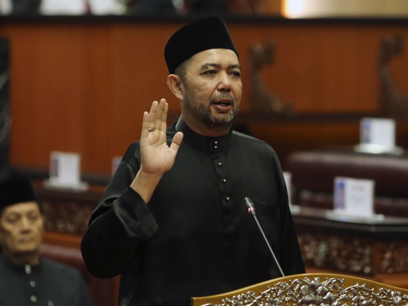 Malaysian deputy foreign affairs minister Marzuki Yahya takes the oath of office as a senator in the upper house of Malaysia's parliament in July 2018.