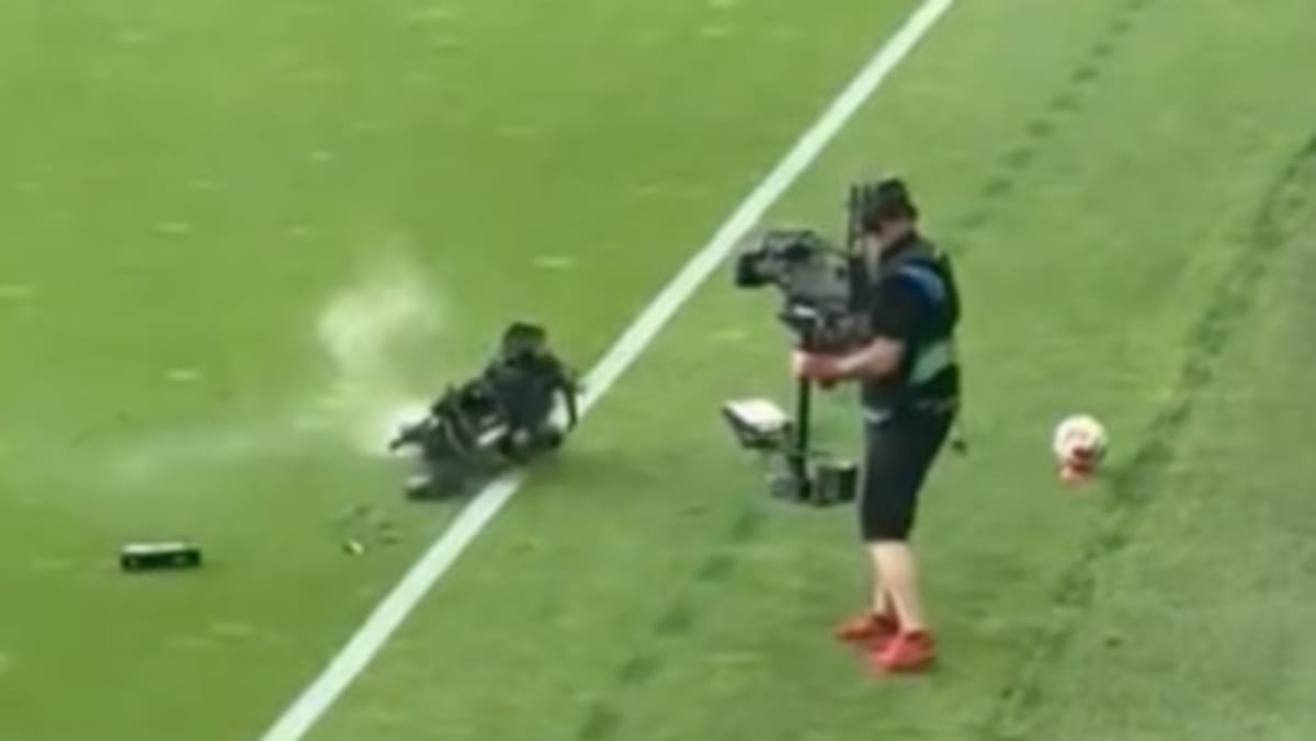 Cameraman narrowly avoids falling TV camera during Hungary-Kazakhstan match - CNA
