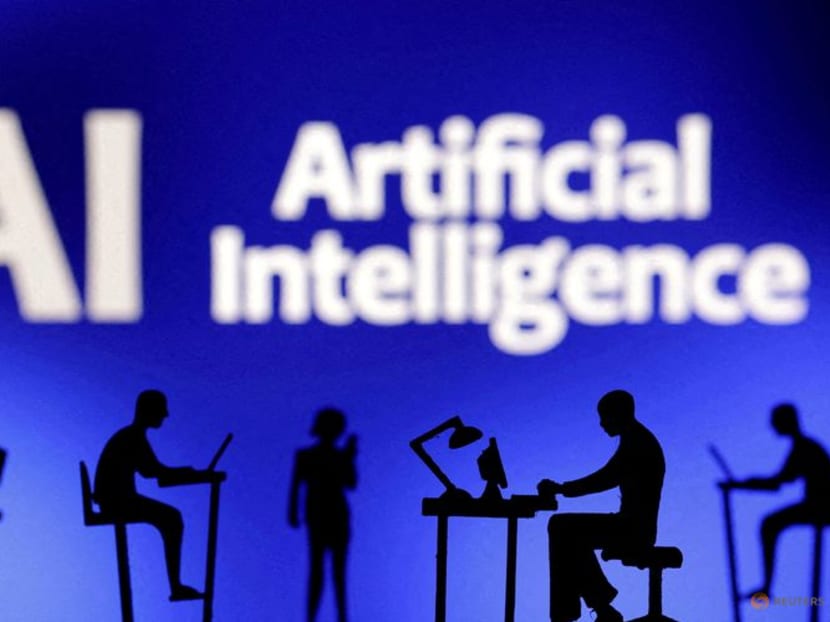 Figurines with computers and smartphones are seen in front of the words "Artificial Intelligence AI" in this illustration taken, Feb 19, 2024.