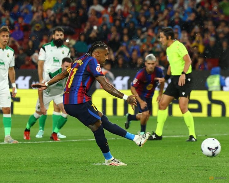 Flick sets record as Barcelona breeze past Racing with Raphinha hat-trick