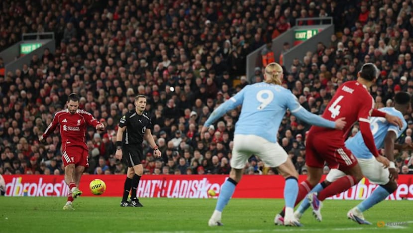 Man City snatch chaotic 2-1 win at Liverpool to stay on Arsenal's heels