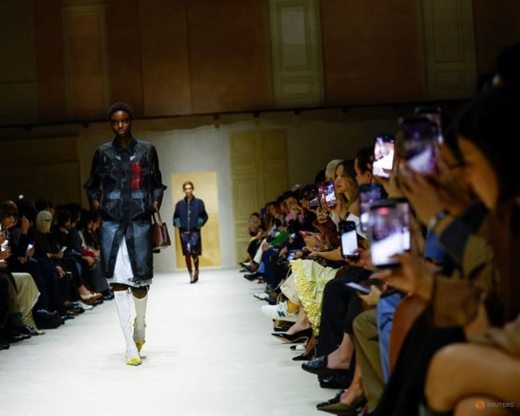 Prada layers winter jackets over light dresses at Milan show as Zuckerberg's presence fuels smart glasses talk