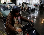 Pakistan commuters switch to EV scooters as petrol prices soar