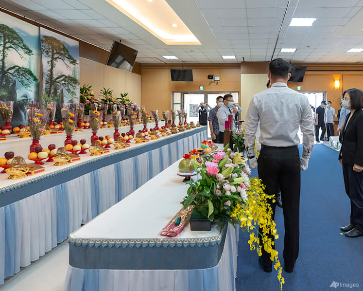 Taiwan's leader pays respects to 46 dead in building inferno