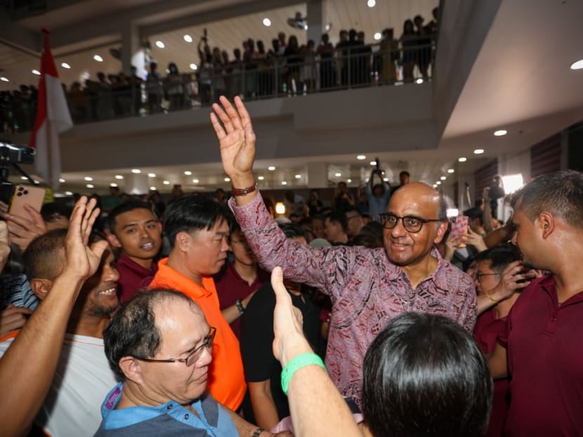 Mr Tharman Shanmugaratnam (second from right) greeting supporters at Taman Jurong Market and Food Centre while waiting for the results of the Presidential Election on on Sept 1, 2023.