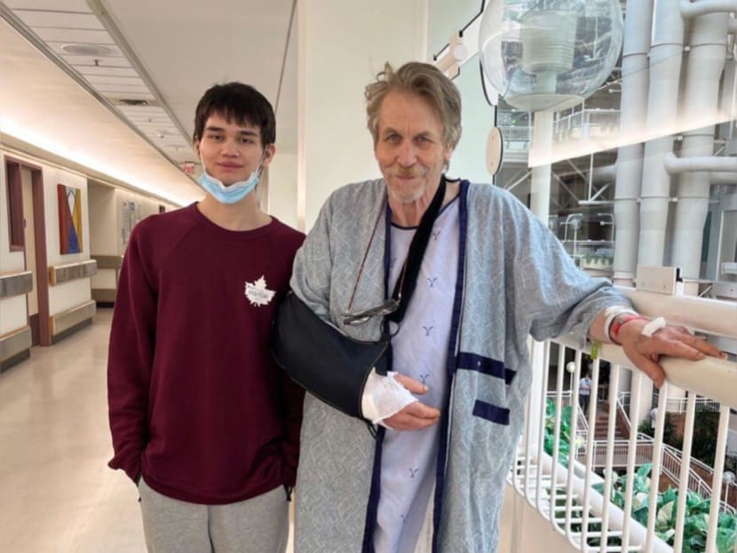 Mr Hugh Harrison (right), 71, and his son Charlie getting their photo taken at the University of Alberta Hospital where he is recovering from an arm injury after a propeller accident. Mr Hugh Harrison (right), 71, and his son Charlie getting their photo taken at the University of Alberta Hospital where he is recovering from an arm injury after a propeller accident.
