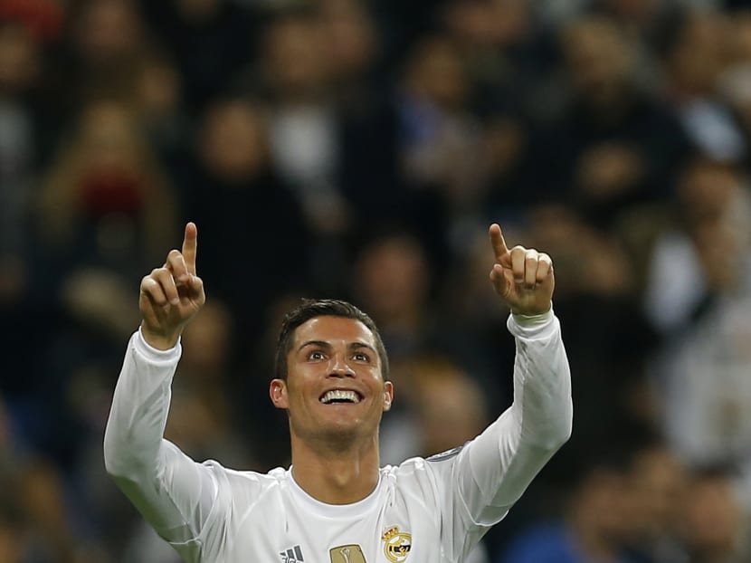 Real Madrid’s Cristiano Ronaldo celebrates scoring his side's 5th goal during a Champions League group A soccer match between Real Madrid and Malmo at the Santiago Bernabeu stadium in Madrid, Dec 8, 2015. Photo: AP