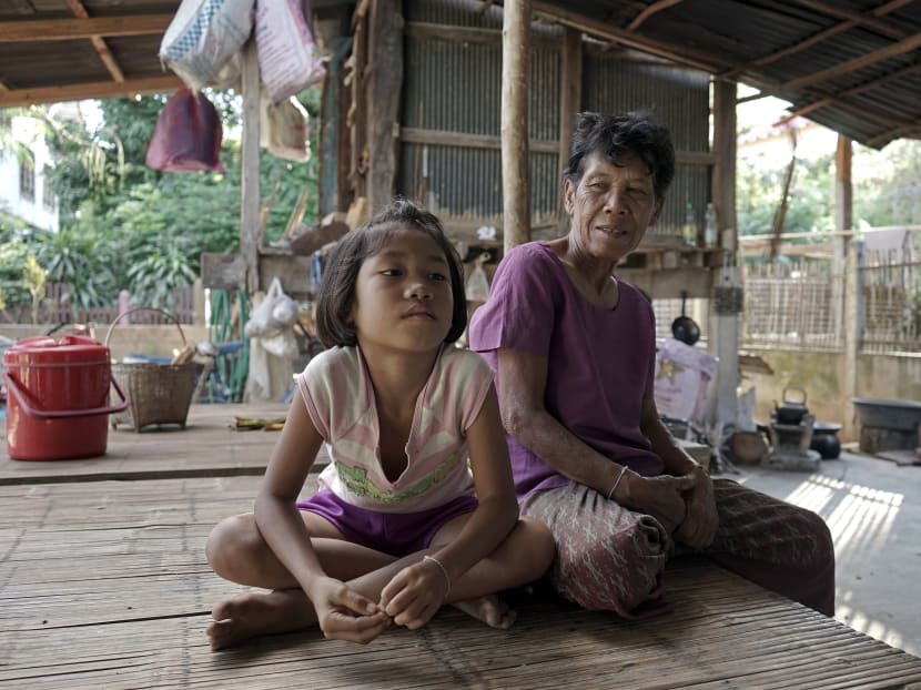 Eight-year-old Chayanit with her grandmother, Ms Chanpen Uthachan. Photo: AFP