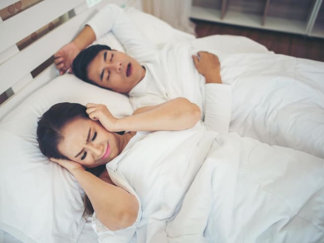My partner snores. How can I get some sleep and wake up rested?