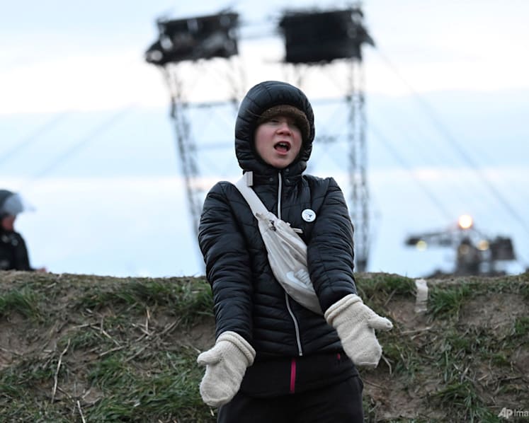 Climate activists occupy giant digger at German coal mine