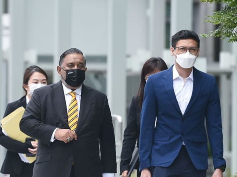 Ahmad Danial Mohamed Rafa'ee (right) and his lawyer Shashi Nathan (left) arriving at the State Courts on July 6, 2022.