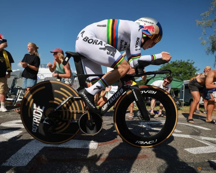 Evenepoel wins time trial to cut Pogacar's lead