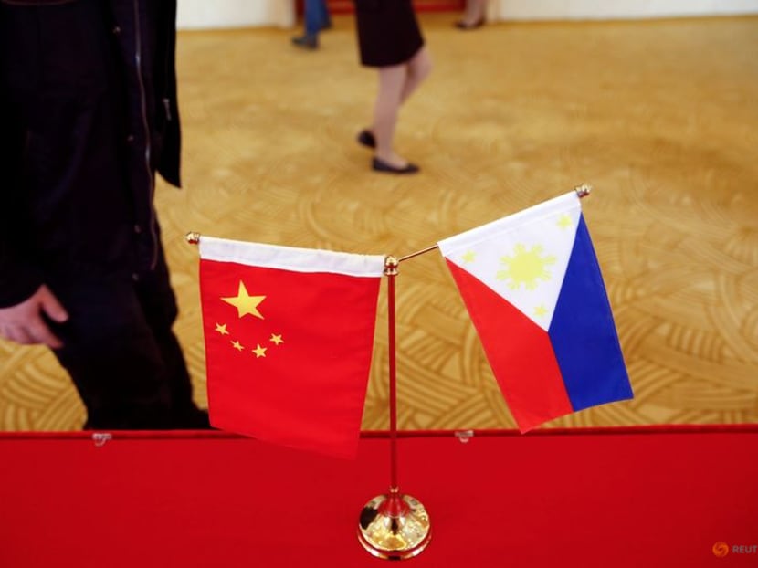 FILE PHOTO: National flags are placed outside a room where Philippine Finance Secretary Carlos Dominguez and China's Commerce Minister Gao Hucheng address reporters after their meeting in Beijing, China, January 23, 2017. REUTERS/Damir Sagolj/File Photo