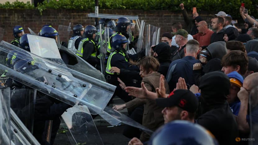 UK interior minister condemns violent reaction to handcuffed student's murder