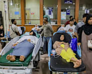 Indonesian officials say government-supplied meals tested after more than 500 students fall ill