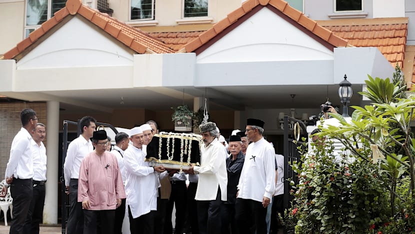 Crowds brave torrential downpour as Othman Wok is laid to rest