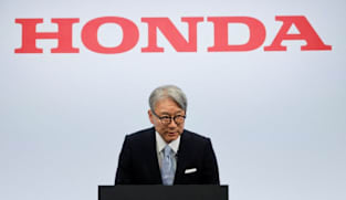 Honda CEO apologises for company's loss, wins investor backing at annual meeting