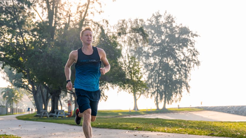 Briton breaks world record for longest triathlon by running, cycling and swimming 7,500km in Singapore