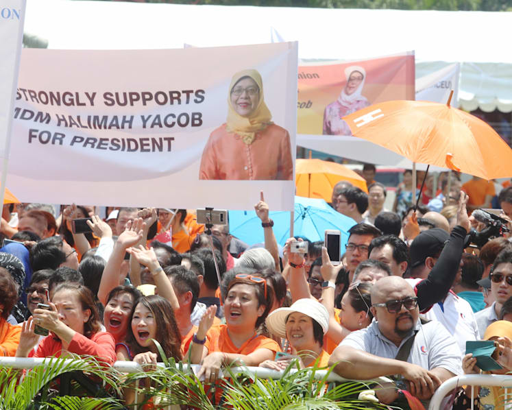 Sea of orange as supporters witness Halimah's historic rise to presidency
