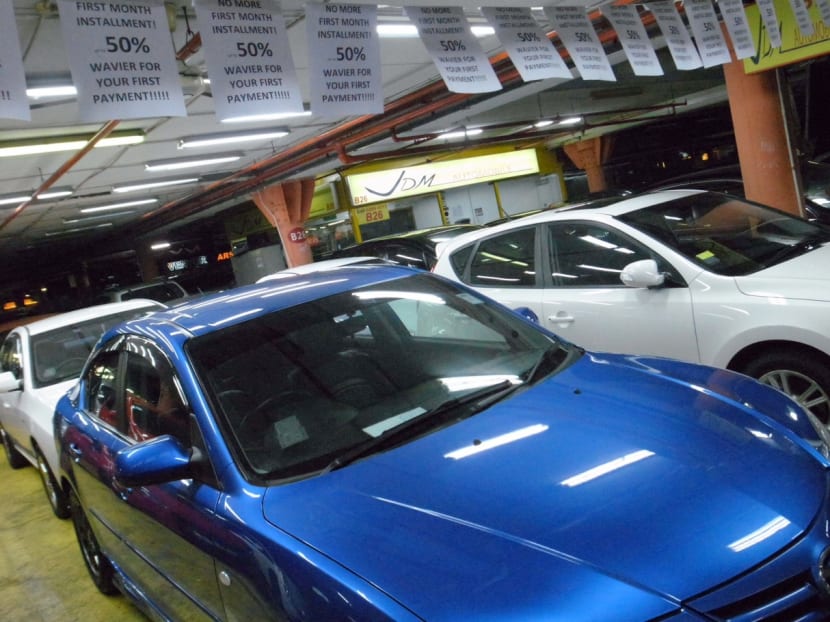 Some used-car dealers have slashed prices to draw customers. Photo: Don Wong