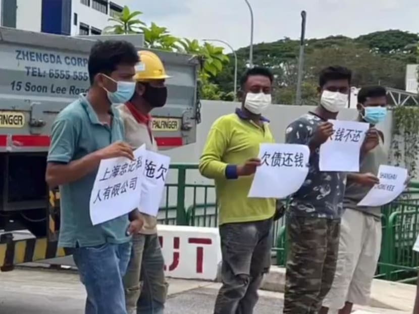 A screenshot taken from social media of the men outside the NCS Hub Ang Mo Kio on Oct 18, 2022. A screenshot taken from social media of the men outside the NCS Hub Ang Mo Kio on Oct 18, 2022.