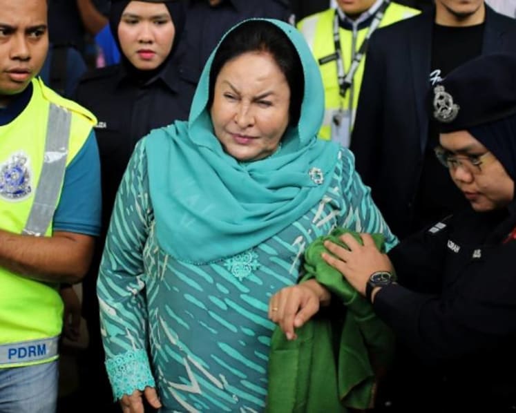 Najib’s wife Rosmah fails to show up in court as she is still in Singapore, ordered to appear next Monday