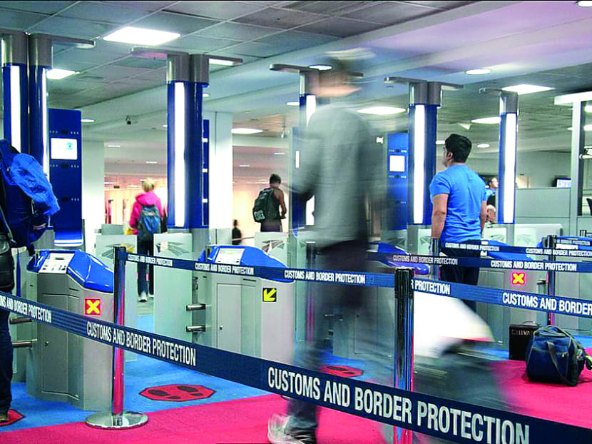 SmartGate operates on facial-recognition technology that matches the image taken of travellers at a kiosk screen with the digital facial image stored in the electronic chip in their biometric passport. 
Photo: Australian Customs and Border 
Protection Service