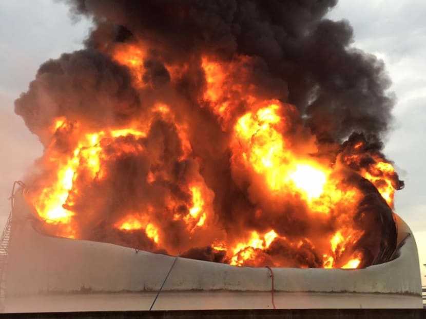The 40m by 20m oil tank that caught fire on Jurong Island. Photo: Singapore Civil Defence Force/Facebook The 40m by 20m oil tank that caught fire on Jurong Island. Photo: Singapore Civil Defence Force/Facebook