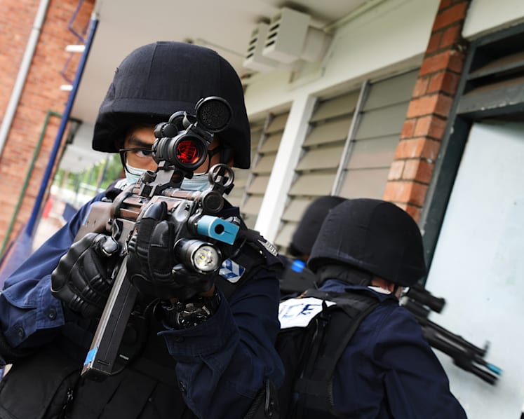 Dark shades, beige berets, submachine guns: The police counterterrorism unit made up mostly of NSFs