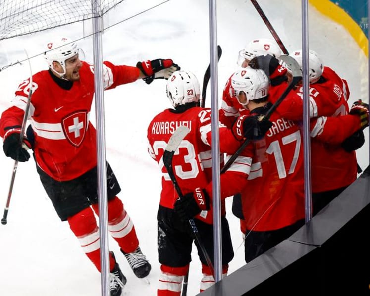 Ice hockey-Canada thrash France 10-2, Swiss top Czechs in OT, Denmark down Latvia