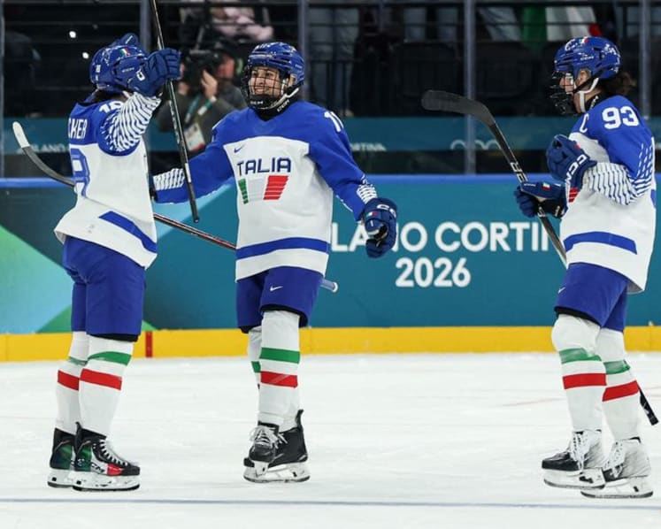 Ice hockey-Italian fans keep party going despite heavy defeat by Sweden