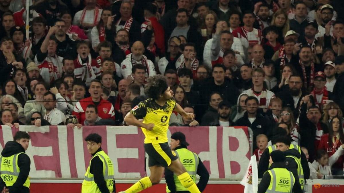 Dortmund score twice in stoppage time to beat Stuttgart 2-0