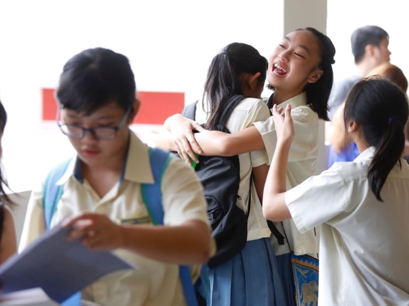 Students collecting their PSLE results at Changkat Primary School on Friday (Nov 24). Photo: Raj Nadarajan/TODAY