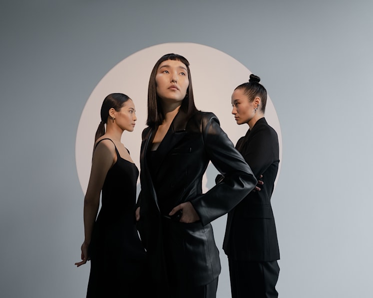 Why do we keep buying black clothes – even when we want to wear more colour?