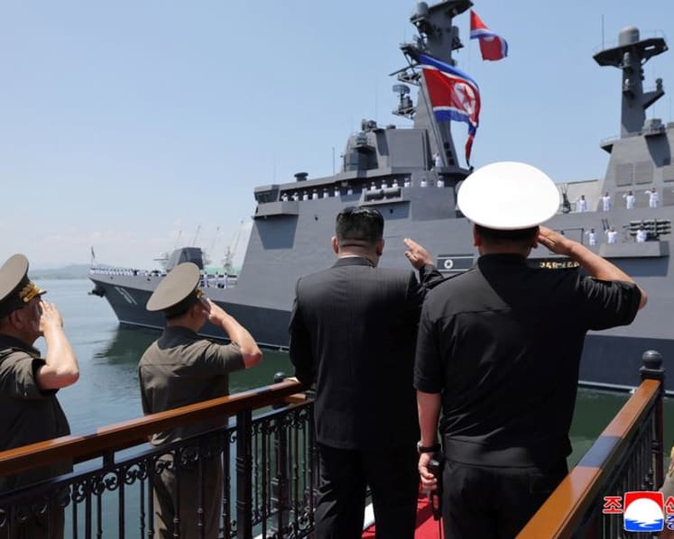 North Korea's Kim unveils plans for 10,000-tonne warships, nuclear navy