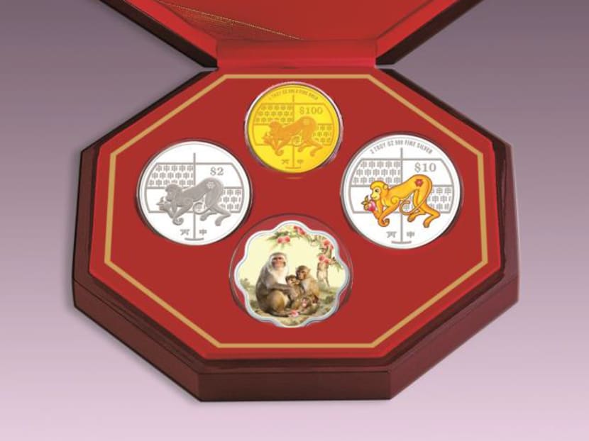 The 3-in-1 premiun Coin Set consists of a 1 troy ounce 999.9 fine gold proof coin, a 2 troy ounce 999 fine silver piedfort proof coloured coin, a cupro-nickel proof-like coin and a floral-shaped ingot. Photo: MAS The 3-in-1 premiun Coin Set consists of a 1 troy ounce 999.9 fine gold proof coin, a 2 troy ounce 999 fine silver piedfort proof coloured coin, a cupro-nickel proof-like coin and a floral-shaped ingot. Photo: MAS
