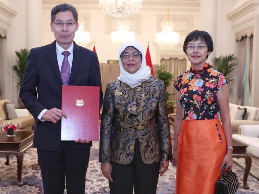 President Halimah Yacob (centre) with Mr Lui Tuck Yew (left), Singapore’s Ambassador-designate to China, and his wife.