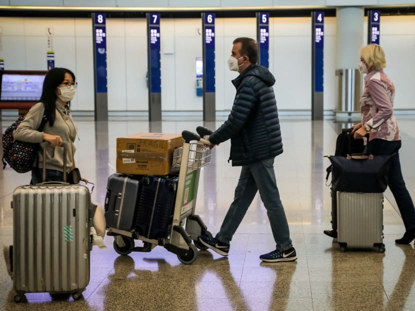 A file photo of travellers at Hong Kong International Airport.
