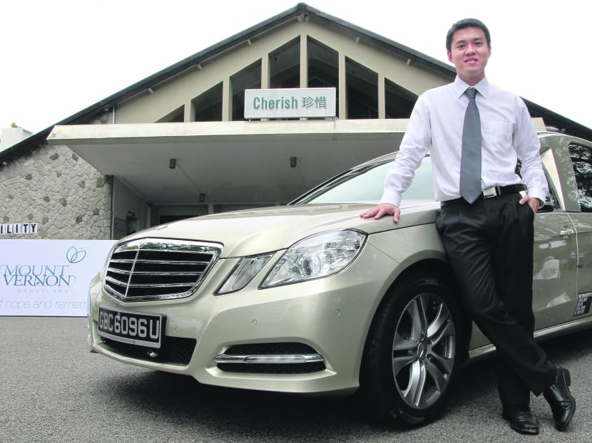 Mr Ang Ziqian, Director of Mount Vernon Sanctuary, with a modified Mercedes hearse. Photo: Don Wong
