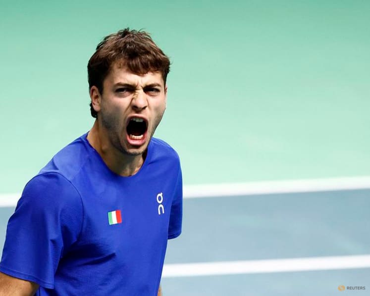 Battling Cobolli sends holders Italy into Davis Cup final