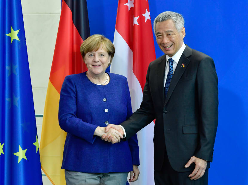 German Chancellor Angela Merkel and Singapore's Prime Minister Lee Hsien Loong shake hands after giving a joint press conference on July 6, 2017 at the Chancellery in Berlin. Photo: AFP German Chancellor Angela Merkel and Singapore's Prime Minister Lee Hsien Loong shake hands after giving a joint press conference on July 6, 2017 at the Chancellery in Berlin. Photo: AFP