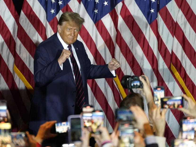 Republican presidential hopeful and former US President Donald Trump gestures during an Election Night Party in Nashua, New Hampshire, on Jan 23, 2024. 
