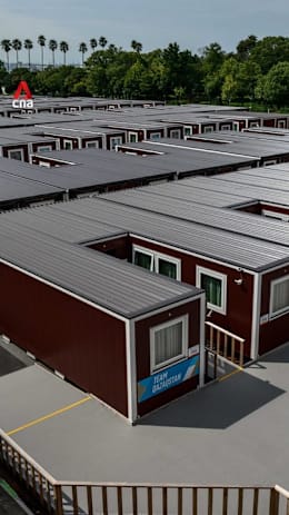 Inside the wooden container huts housing Asian Games athletes